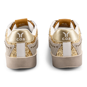 Play Womens Leather Sneaker in gold with glitter wing